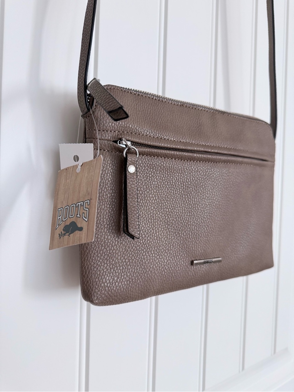 Roots Pebbled Taupe Crossbody Bag with Front Zip. Faux Leather